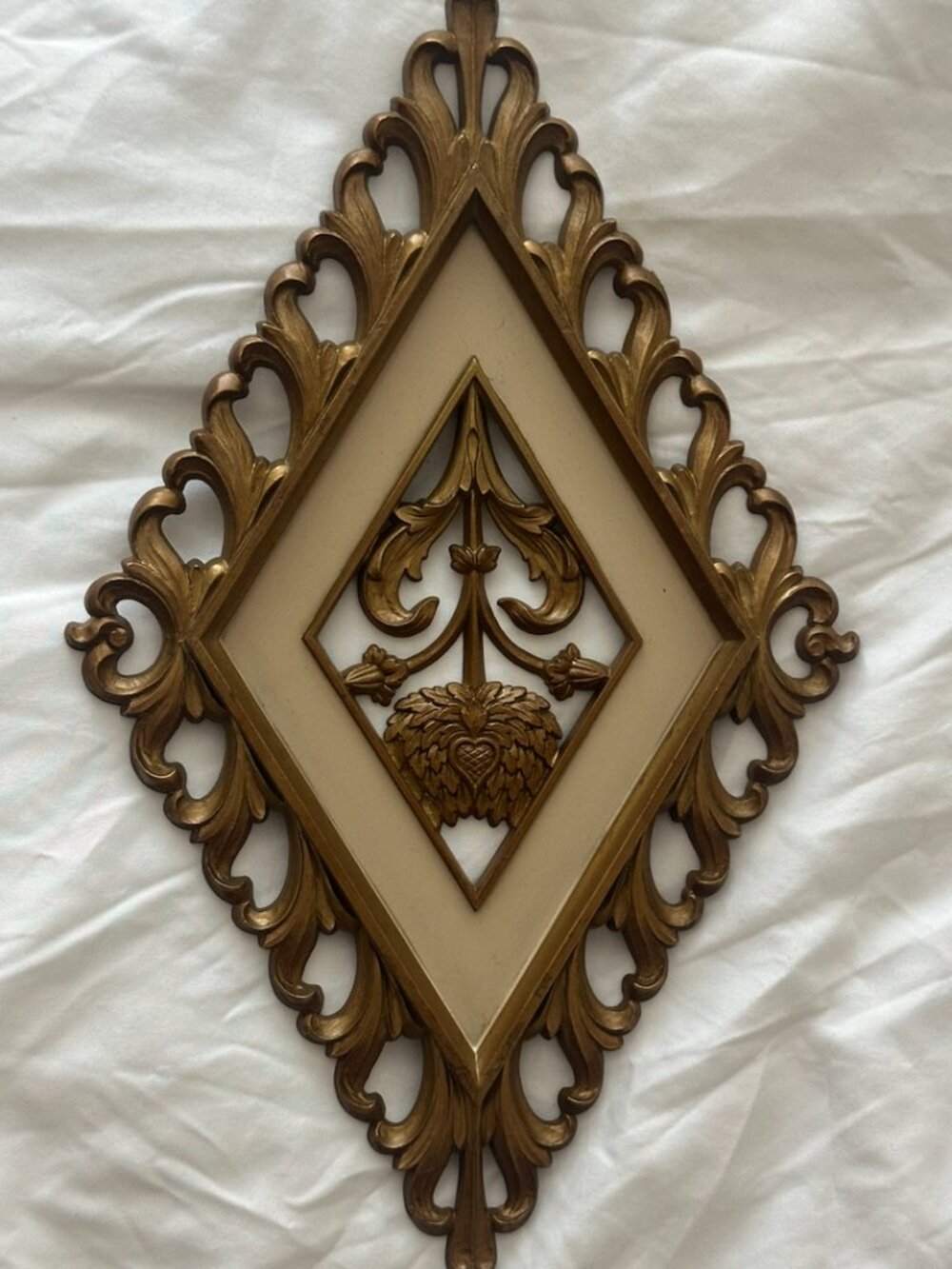 gold-painted Dart Industries floral wall plaque